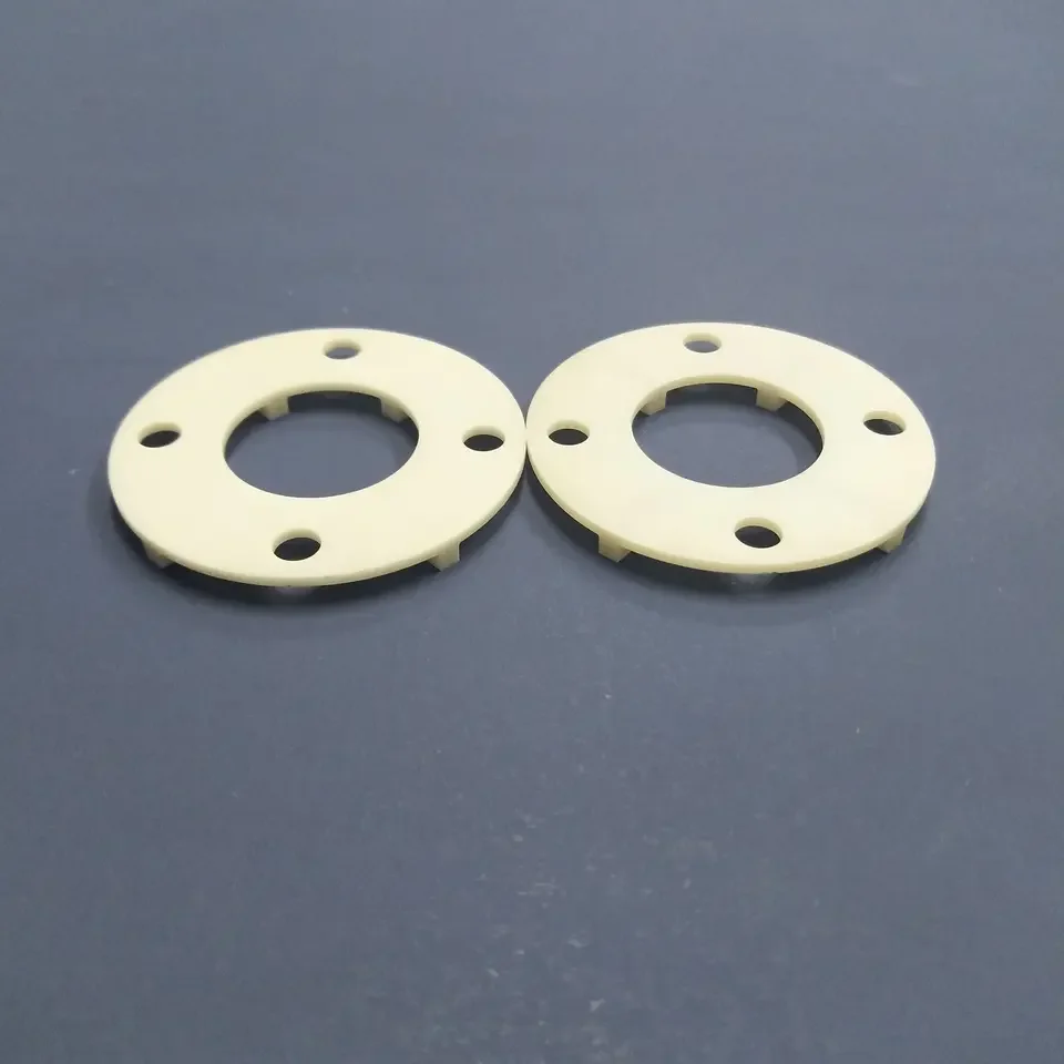 H50344944997f41619d0ceb063459aac4g.webp Aluminum Nitride (AlN) Ceramic Wafer Circular 4 Holes Aluminum Nitride Heat Dissipation Sheet - Image 1
