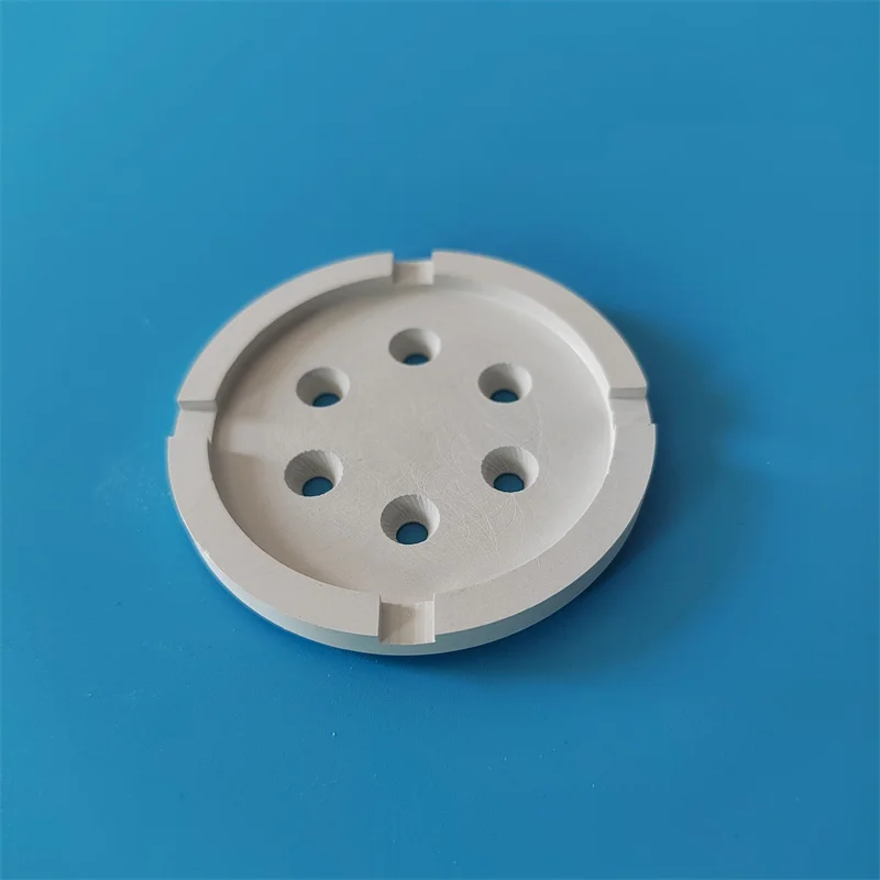 H5534013b2d0e417c97ff6e1b78493d53P.webp Boron Nitride Ceramic Round Plate with Slot & Hole - Image 1