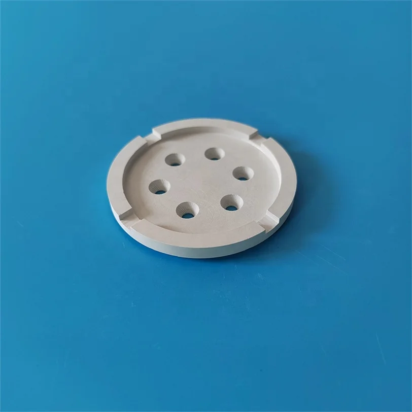 H69c99ccf34a74ab9bede32cf06688ccaA.webp White Graphite Ceramic Disc Hexagonal Boron Nitride Plate with Holes 99% BN Ceramic Cap HBN Sheet for Industrial Application - Image 1