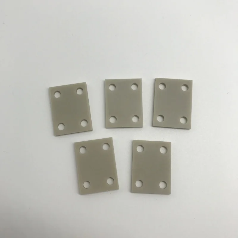 H9ff5f7e615dc4ca0a1d3d1e33f4189bax.webp Aluminum Nitride Ceramic Plate ALN Substrate with Holes for Semiconductor Heat Sink - Image 1